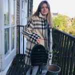 Delia is modelling her mother's coats: Coat wool, Burberry bought 2000, has a matching skirt with Mulberry satchel.