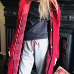 Delia is modelling her mother's coats: Red coat (in front of fireplace) Burberry bought 2004